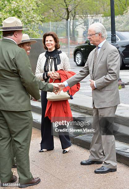 Queen Silvia of Sweden and King Carl XVI Gustaf of Sweden visit Castle Clinton National Monument at Battery Park on May 8, 2013 in New York City.