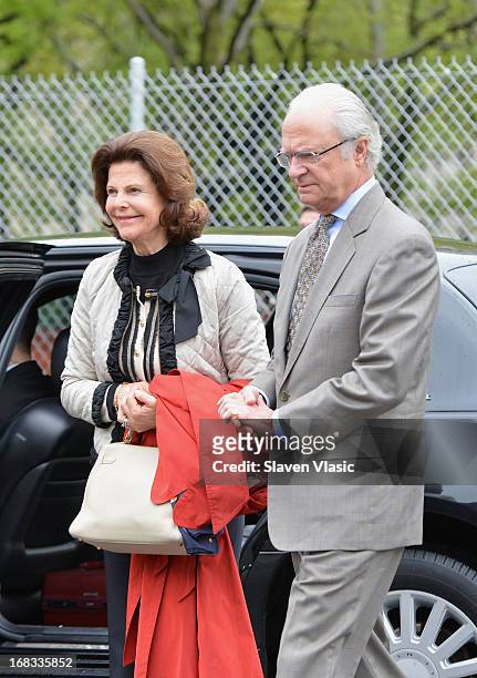 Queen Silvia of Sweden and King Carl XVI Gustaf of Sweden visit Castle Clinton National Monument at Battery Park on May 8, 2013 in New York City.