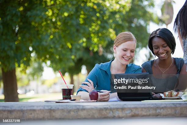 businesswomen working in park - business lunch outside stock pictures, royalty-free photos & images