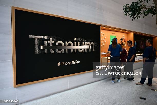 Apple iPhone 15 Pro titanium signage is displayed at The Grove Apple retail store on release day in Los Angeles, California, on September 22, 2023.