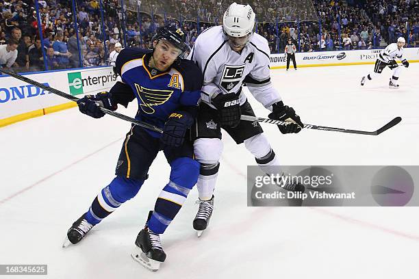 Anze Kopitar of the Los Angeles Kings checks Alex Pietrangelo of the St. Louis Blues while pursuing a loose puck in Game Five of the Western...