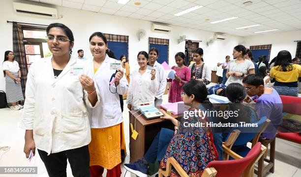 Students stand in queue to cast their votes for DUSU University student's union elections, at Miranda college North Campus, on September 22, 2023 in...