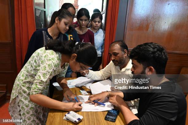 Students stand in queue to cast their votes for DUSU University student's union elections, at Miranda college North Campus, on September 22, 2023 in...