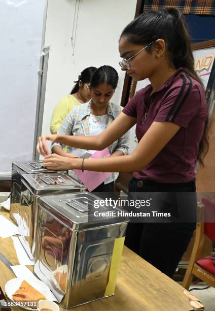 Students casting their votes for DUSU University student's union elections, at Miranda college North Campus, on September 22, 2023 in New Delhi,...