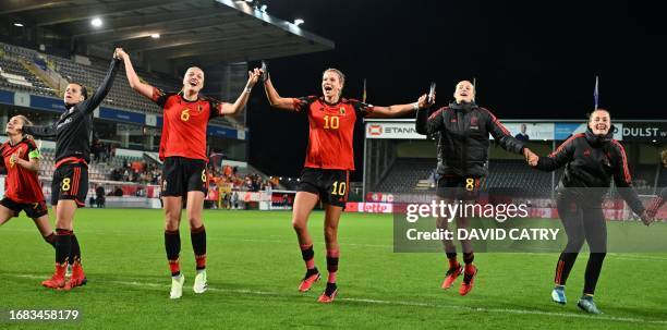 Belgium's players celebrate after winning a match between Belgium's national women's team the Red Flames and The Netherlands, game 1/6 in the 2023¿24...