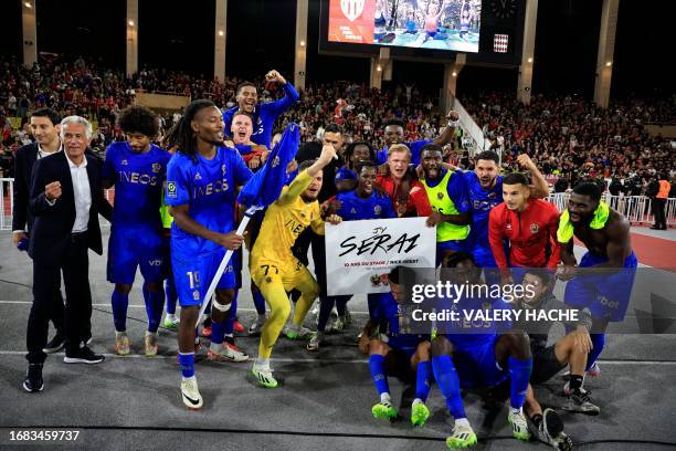 Nice's players celebrate after winning the French L1 football match between AS Monaco and OGC Nice at the Louis II Stadium in the Principality of...