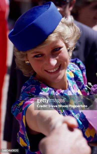 Princess Diana greeting crowds of well-wishers at Bayview after attending a service at St Andrew's Cathedral in Syndey, Australia during a visit, on...