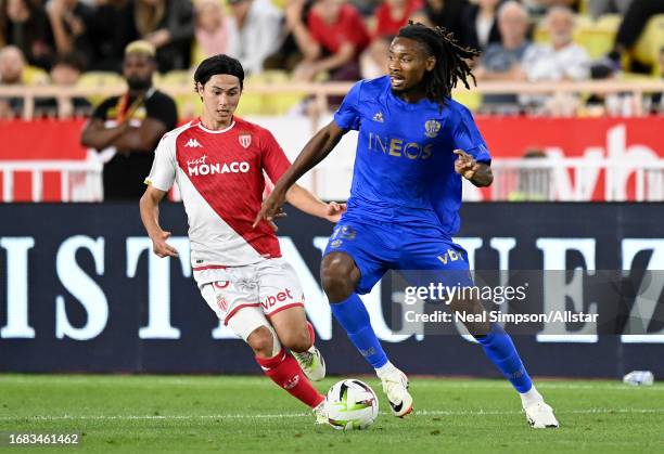 Takumi Minamino of AS Monaco and Khephren Thuram of OGC Nice in action during the Ligue 1 Uber Eats match between AS Monaco and OGC Nice at Stade...