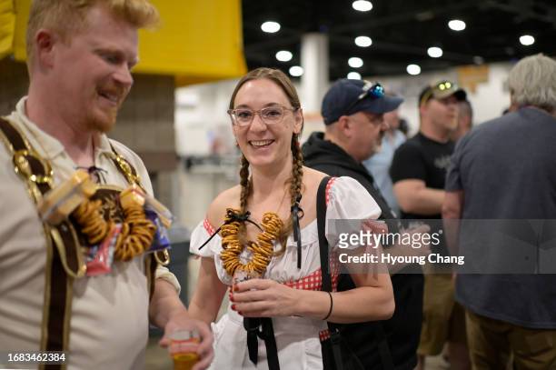 Marc Bergen, left, and Claire Le Lait having beers during Great American Beer Festival at Colorado Convention Center in Denver, Colorado on Friday,...