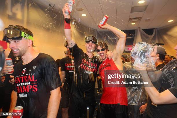 Max Kepler and Joe Ryan of the Minnesota Twins celebrate in the clubhouse at Target Field on September 22, 2023 in Minneapolis, Minnesota. The...