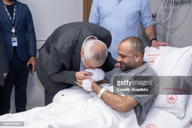 Chairman of the Hamas Political Bureau, Ismail Haniyeh pays a visit to Palestinian photojournalist Ashraf Amra , a freelancer for Turkiye's premier...