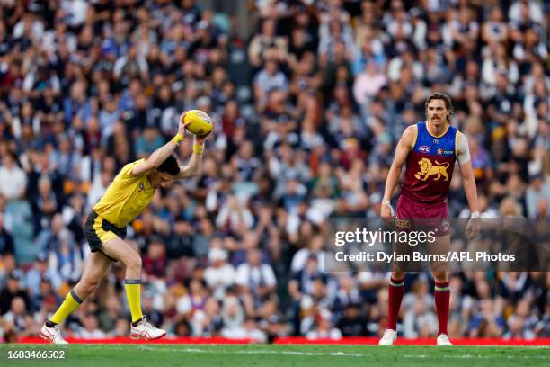 Joe Daniher of the Lions is seen as the umpire bounces the ball during the 2023 AFL Second Preliminary Final match between the Brisbane Lions and the...