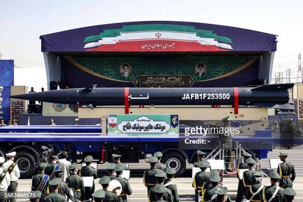 Truck carries an Iranian 'Fattah' hypersonic ballistic missile during the annual military parade marking the anniversary of the outbreak of the...