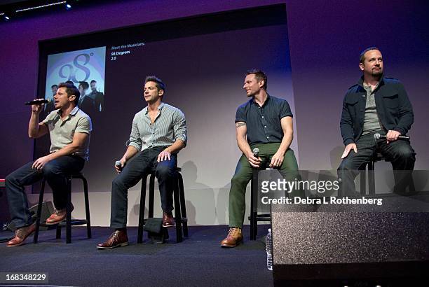 Musicians Nick Lachey, Jeff Timmons, Drew Lachey and Justin Jeffre of 98 Degrees at Apple Store Soho on May 8, 2013 in New York City.
