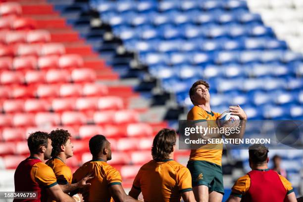 Australia's full back Andrew Kellaway catches the ball during the captain's run training session at OL Stadium in Decines-Charpieu, southeastern...