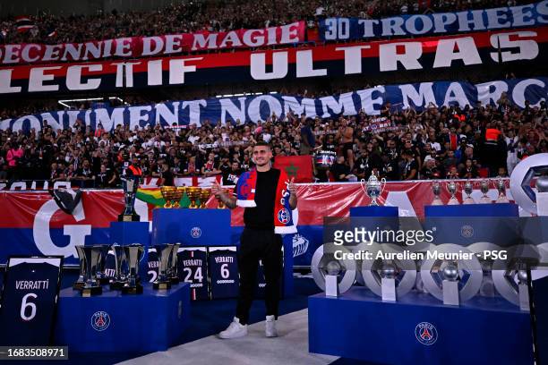 Marco Verratti poses next to all the trophies he won with Paris Saint-Germain during his farewell ceremony before the Ligue 1 Uber Eats match between...