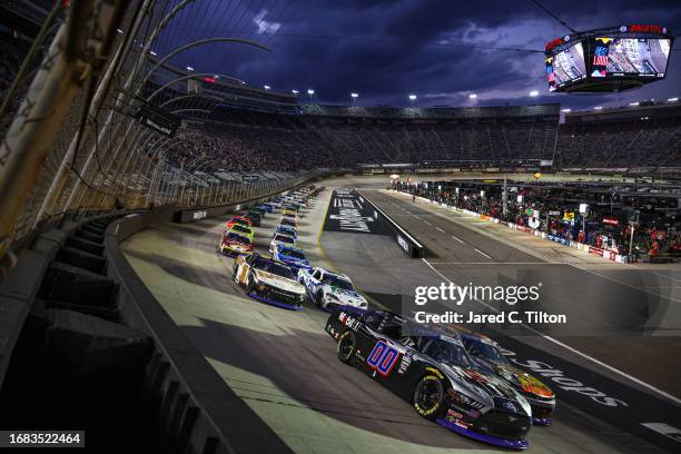 Cole Custer, driver of the Mobil 1 Ford, and Josh Berry, driver of the Bass Pro Shops/TRACKER Boats Chevrolet, leads the field during the NASCAR...