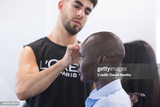 Model prepares backstage prior to the catwalk of the Malne fashion show during the Mercedes Benz Fashion Week Madrid at Ifema on September 15, 2023...