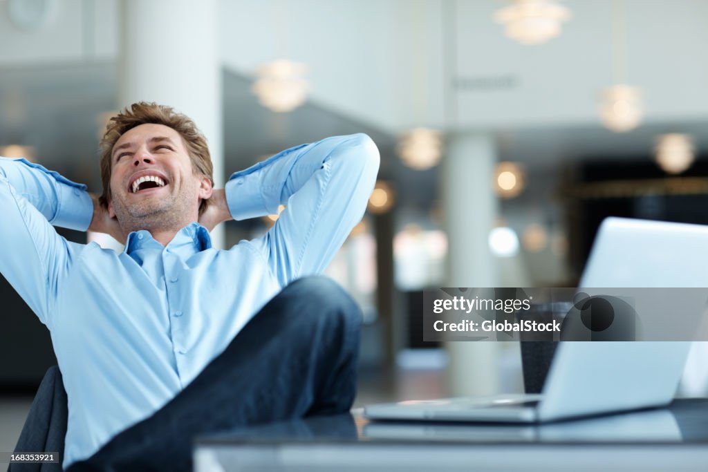 Relaxed business man laughing