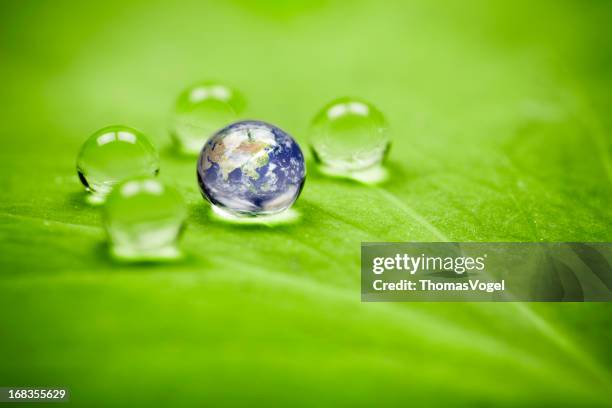 planet earth waterdrop leaf. asia water green drop globe environment - day of the dead stockfoto's en -beelden