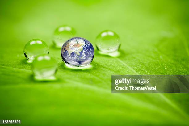 planet earth waterdrop leaf. asia water green drop globe environment - hemisphere stock pictures, royalty-free photos & images