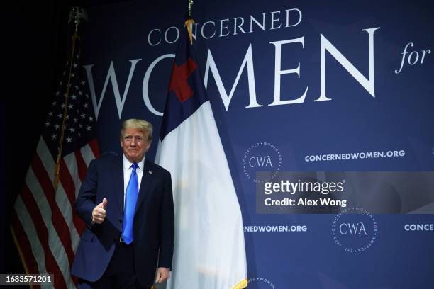 Former U.S. President Donald Trump gestures as he arrives to address the Concerned Women for America Legislative Action Committee on September 15,...