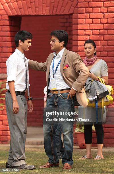 Cabinet Minister Jyotiraditya Madhavrao Scindia with his son Aryaman Scindia and friend Puneet Sharma poses for a picture while his wife tries to...
