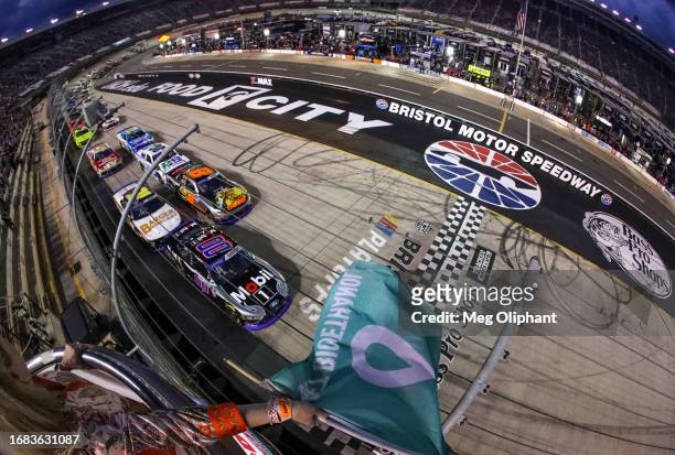 Cole Custer, driver of the Mobil 1 Ford, leads the field to the green flag to start the NASCAR Xfinity Series Food City 300 at Bristol Motor Speedway...