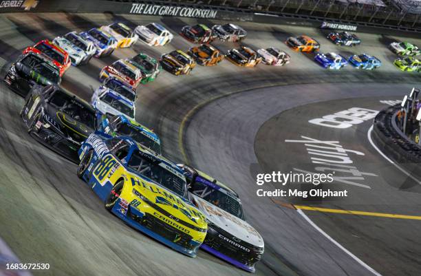 Dale Earnhardt Jr., driver of the Hellmann's Chevrolet, and Chandler Smith, driver of the Barger Precast Chevrolet, race during the NASCAR Xfinity...