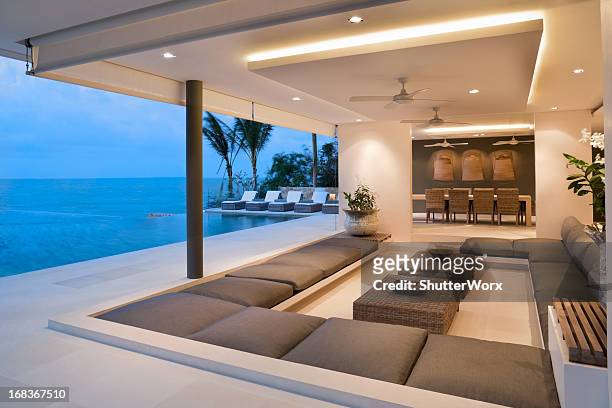 modern island villa - luxury mansion interior stock pictures, royalty-free photos & images