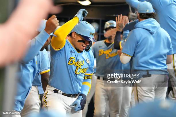 William Contreras of the Milwaukee Brewers dances in the dugout to celebrate a three-run home run against the Washington Nationals during the fifth...