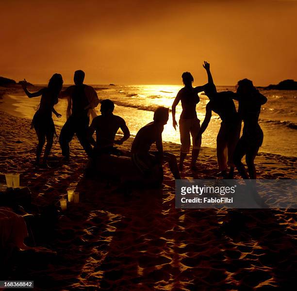hot party on the beach - fabio filzi stock pictures, royalty-free photos & images