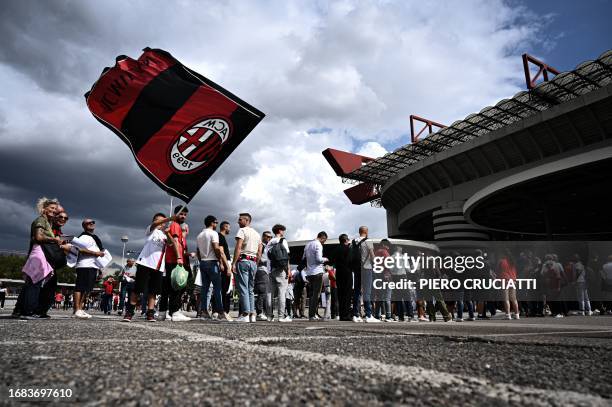 Milan supporters arrive at the San Siro stadium prior to the Italian Serie A football match between AC Milan and Hellas Verona in Milan, on September...