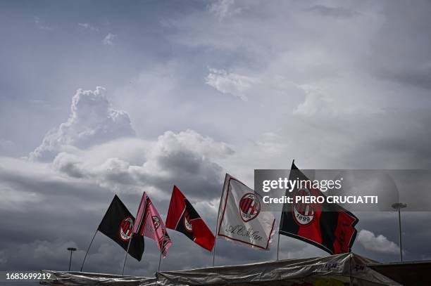 Milan supporters flags are seen outside the San Siro stadium prior to the Italian Serie A football match between AC Milan and Hellas Verona in Milan,...