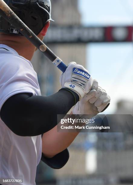Detailed view of the custom Franklin Jackie Robinson Day batting gloves worn by Spencer Torkelson of the Detroit Tigers as he waits on-deck to bat...