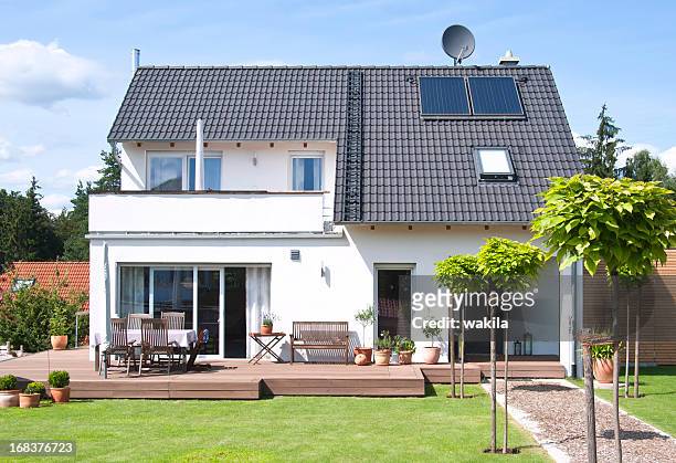 new house home view from garden with way - einfamilienhaus - woonhuis stockfoto's en -beelden