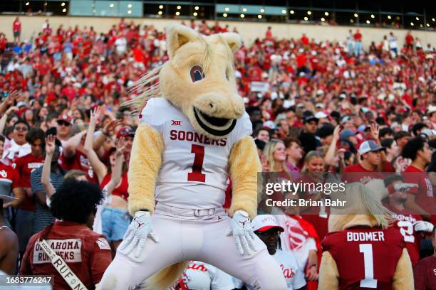 Sooner', a mascot for the Oklahoma Sooners dances with 'Boomer' during a break in the game against the SMU Mustangs at Gaylord Family Oklahoma...