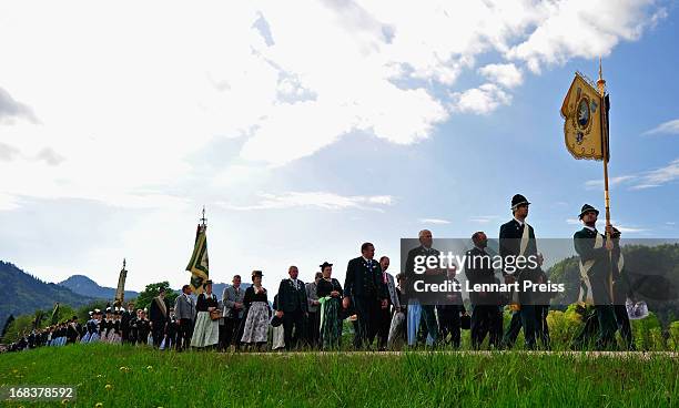 Villagers wearing Bavarian folk costumes specific to the Chiemsee region of southern Bavaria participate in the annual Ascension Day procession on...