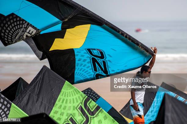 Narapichit Pudla of Thailand holds a kite during day one where of the KTA Series on Pingtan Island on May 9, 2013 in Fuzhou, China. There was only...