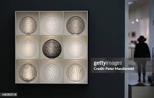 Works by artist Tobias Mohl are displayed at the Collect art fair at Saatchi Gallery on May 9, 2013 in London, England. Celebrating its 10th...