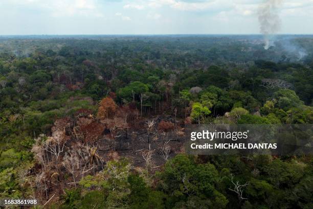 This aerial view shows a deforested and burning area of the Amazon rainforest in Autazes, Amazonas, Brazil, on September 22, 2023. According to the...