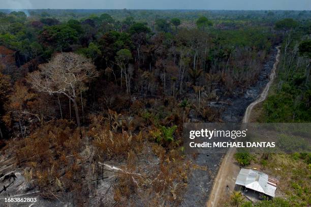 This aerial view shows a deforested and burning area of the Amazon rainforest in Autazes, Amazonas, Brazil, on September 22, 2023. According to the...