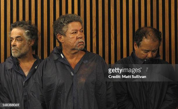 Onil Castro, Pedro Castro and Ariel Castro stand in the courtroom during Ariel's arraignment on rape and kidnapping charges May 9, 2013 in Cleveland,...