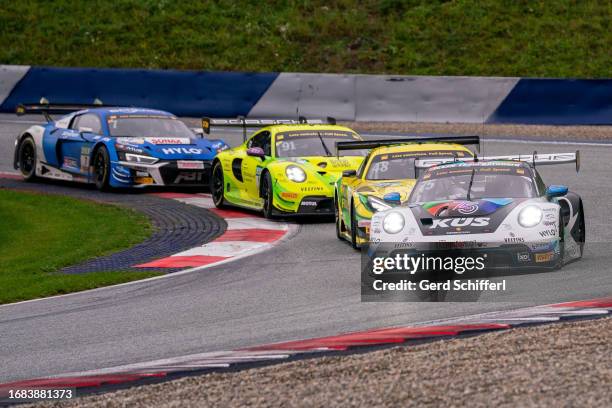 Laurin Heinrich from Germany in his Porsche 911 GT3 R by KUES Team Bernhard, Maro Engel from Germany in his Mercedes-AMG GT3 EVO by Mercedes-AMG Team...