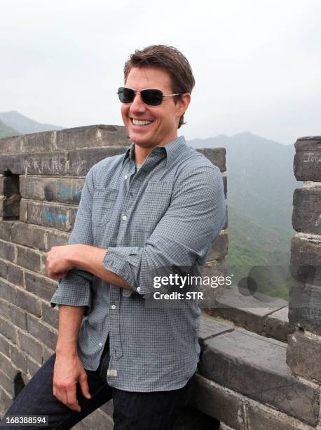 American actor and producer Tom Cruise visits the Mutianyu Great Wall in Beijing on May 9, 2013. His new movie "Oblivion" would be released in China...