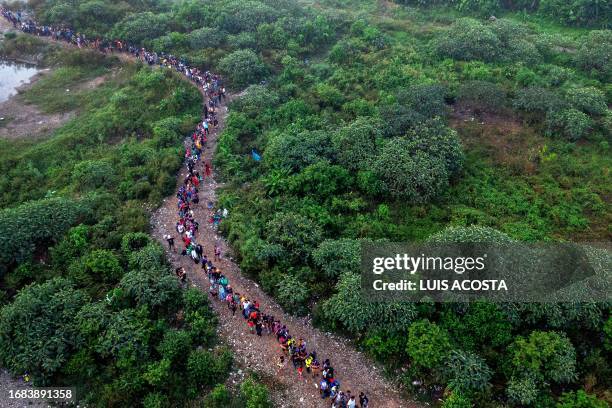 Aerial view of Migrants walking by the jungle near Bajo Chiquito village, the first border control of the Darien Province in Panama, on September 22,...