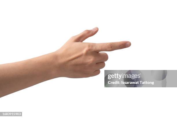 a hand holding an invisible gun, isolated on white background - mirare foto e immagini stock