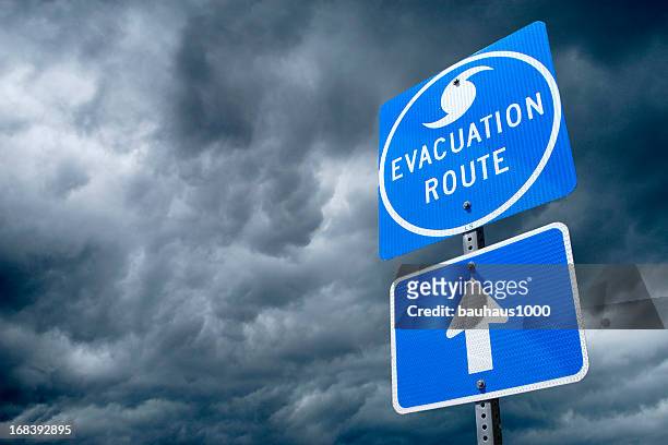 hurricane evacuation route road sign - hurricane symbol stock pictures, royalty-free photos & images