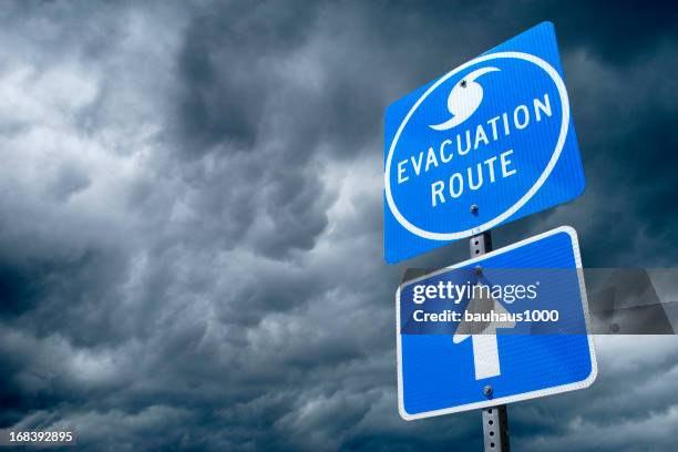 hurricane evacuation route road sign - evacuation stock pictures, royalty-free photos & images