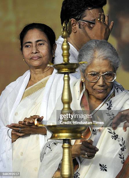West Bengal Chief Minister Mamata Banerjee alongwith Bengali singer Gitasree Sandhya Mukherjee lighting the lamp at Rabindra Sadan during his 152nd...